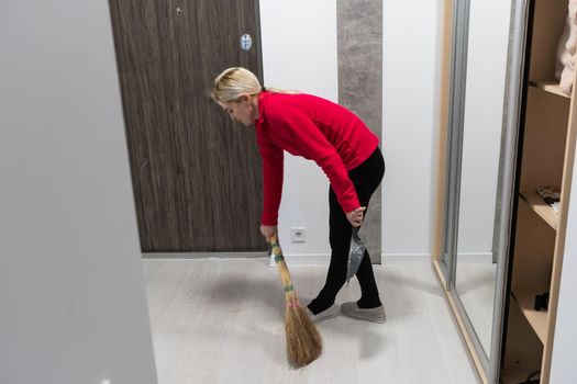 cleaner floor in the building corridor with cleaning tool