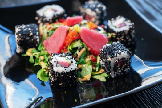 Japanese food sushi and rolls composition with tuna salad