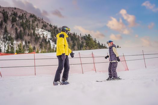 Woman learning to ski with instructor. Winter sport. Ski lesson in alpine school