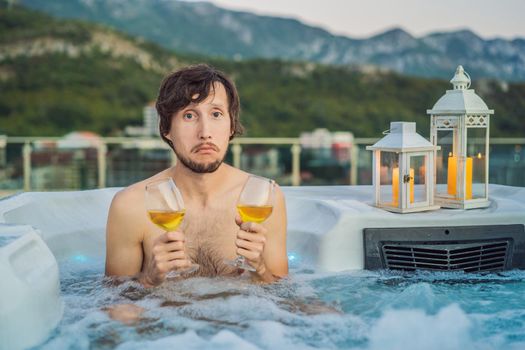 Portrait embarrassed man relaxing at hot tub to whom the woman did not come on a date. February 14 concept. St. Valentine's Day