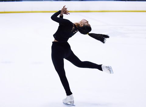 To see her skate is to believe in magic. Shot of a young woman figure skating at a sports arena.