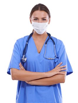 Ready for your surgery. A young surgeon wearing scrubs and a surgical mask looking at the camera.