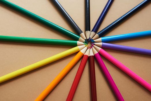 Life is so much more than just black and white. Studio shot of different coloured pencils against a brown background.