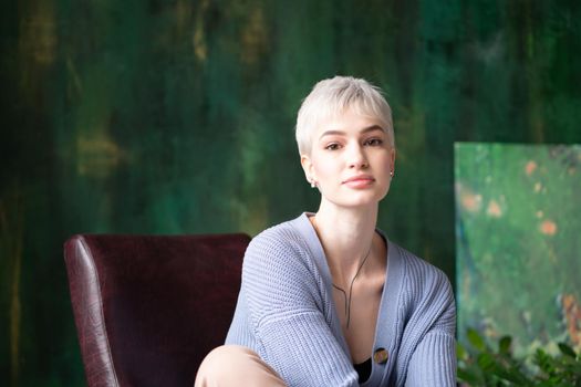 portrait of young woman with short hair in studio