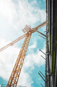 The city isnt just getting bigger, its getting better. Shot of a crane and building at a construction site.