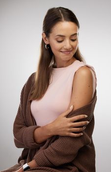 2 Vaxxed, 2 Vurious. Shot of a young woman standing alone in the studio after getting vaccinated.
