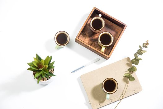 Mango wood wooden tray with four espresso coffee cups. Empty space