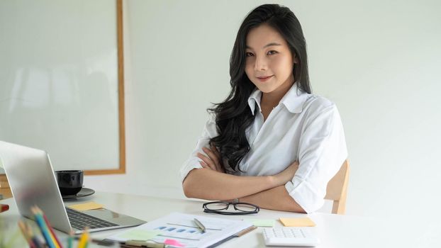 Portrait Of Attractive Asian young business entrepreneur woman working at modern office.