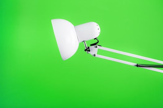 Office table lamp on green background with space for text and idea concept