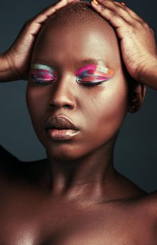 Id lose my mind if it wasnt for color. Cropped shot of a beautiful woman wearing colorful eyeshadow while posing against a grey background.
