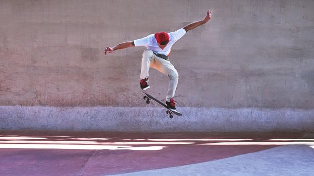 Change requires a leap of faith. Shot of a young man doing tricks on his skateboard at the skatepark.