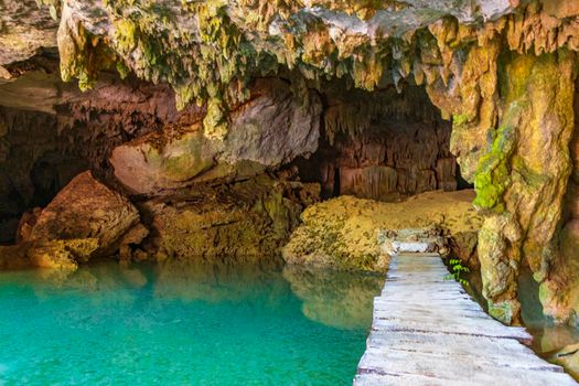 Amazing blue turquoise water and limestone cave sinkhole cenote Mexico.