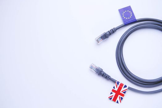 Internet cable with UK and EU flag. Internet cable with UK flag.