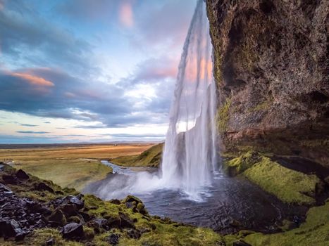 Seljalandsfoss waterfall wide angle at dawn in Iceland