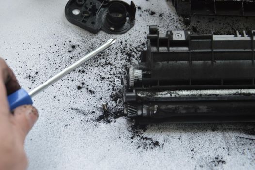 Charging the laser printer cartridge with toner powder