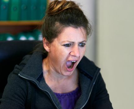 I cant believe this. Cropped shot of an angry woman yelling in anger.