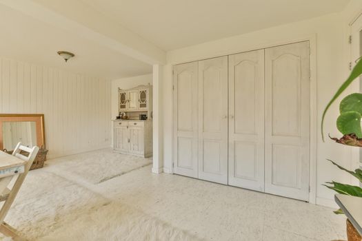 A spacious room with terry carpets on the floor