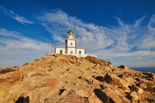Lighthouse on a rock in Santorini island, Greece