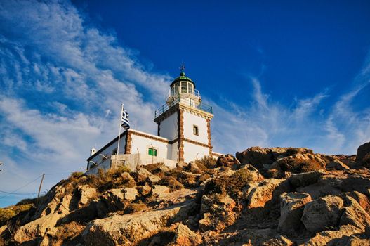 Lighthouse on a rock in Santorini island, Greece