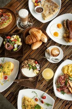 Western big gourmet breakfast selection mixed dishes on restaurant table