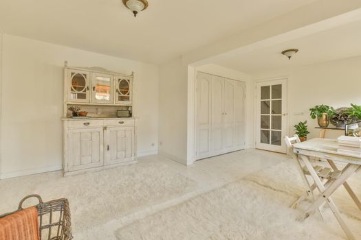 A spacious room with terry carpets on the floor