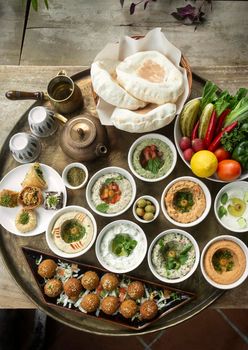 mixed middle eastern meze sharing food platter in turkish restaurant