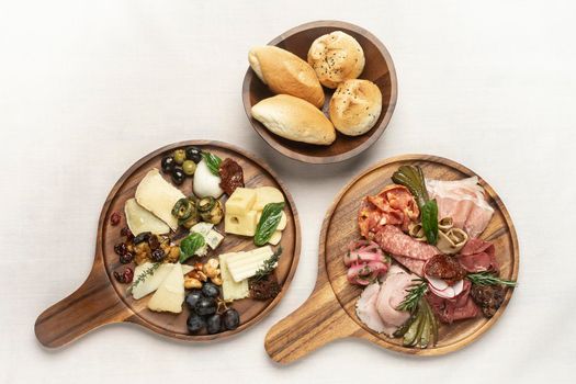 antipasto gourmet charcuterie and cheese cold cuts on wood board