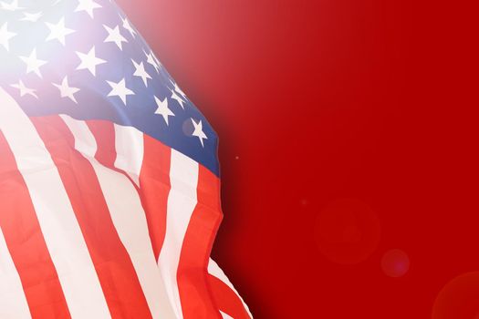 Fragment of american flag on empty red concrete background. Independence day backdrop