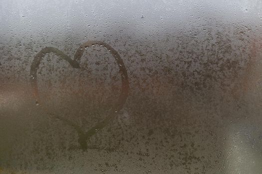 Heart on the Glass. heart on a foggy window