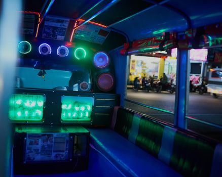 Shot of the inside of an empty party bus at night.