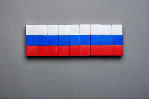 Wooden block background Russian banner design national flag symbolic Russia symbol national banner background RU sign. Isolated block toy wood cube made flag of Russia design background flag concept