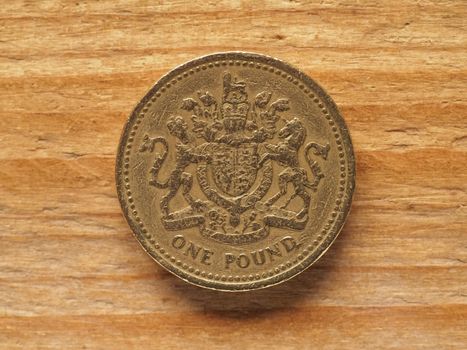 1 Pound coin, reverse side showing Royal Arms representing UK, currency of the UK