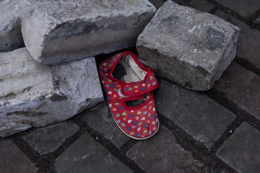 children's shoes in the ruins, the war