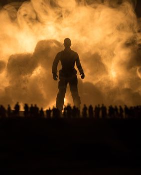 Creative artwork decoration - Russian war in Ukraine concept. Crowd looking on giant explosion and silhouette of giant person. Selective focus