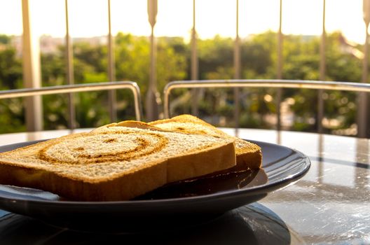 Breakfast with morning light at the balcony