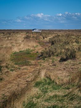 Boat aground on the salt marshes, Blakeney National Nature Reserve, Norfolk