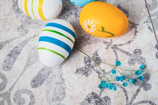 Easter. Multicolored eggs. Yellow and blue Easter decorations.