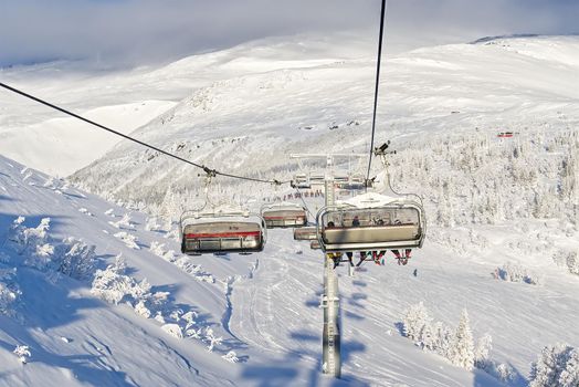 ski lifts in scandinavian resort. ski resort, slope, ski lift with snow, Lapland