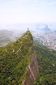 Rios most famous monument Christ the Redeemer. Aerial view of Rio De Janeiro, Brazil.