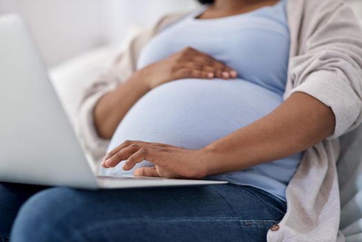 I started this blog in the hopes of helping women through their journey. Cropped shot of a pregnant woman using her laptop while sitting at home.