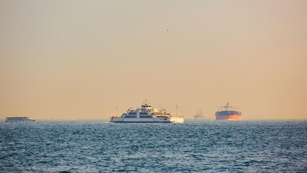 Large cargo container ship passing through Bosphorus, Istanbul, Turkey.