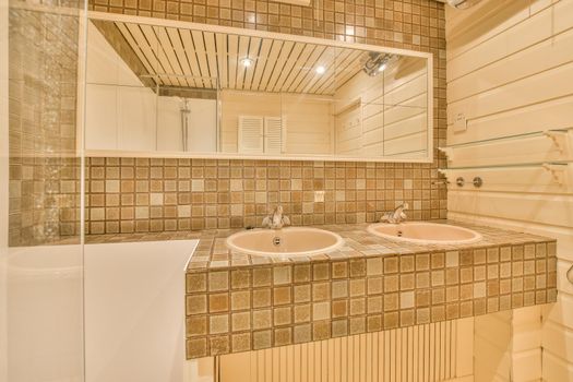 Modern spacious bathroom with colorful mosaic tiles