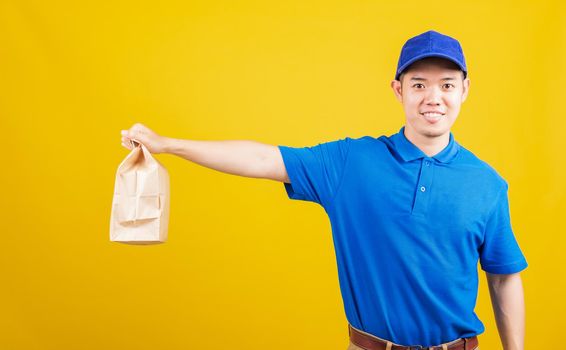 delivery service man smile hold paper containers for takeaway bag grocery food