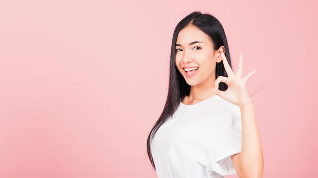 woman standing, She made finger OK symbol sign to agree side away
