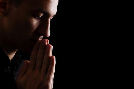 prayer on a dark background