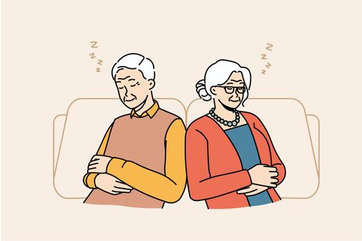 Exhausted senior grandparents relax in chairs sleeping