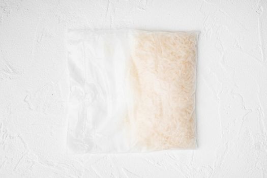 Quick cooking rice bag, on white stone table background, top view flat lay
