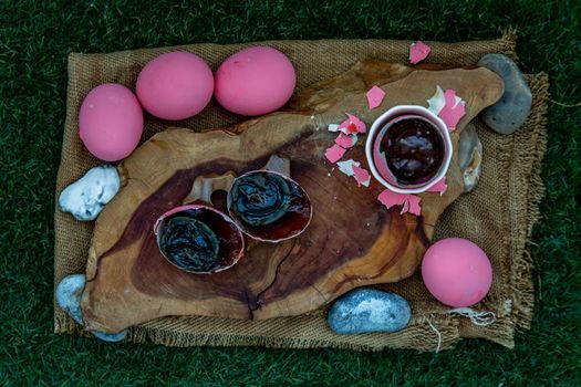 Pink Century eggs (Pidan Eggs) also known as preserved egg, hundred-year egg, thousand-year egg are a Chinese preserved food product and delicacy made by preserving duck, chicken in A Mixture of Ash, Salt, Red Lime, Sodium Carbonate, Tea Leaves and Zinc Oxide.