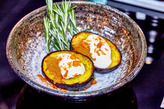 Baked potatoes with sour cream and pike caviar