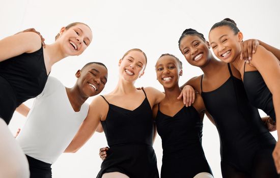 Ill be very glad to be a song and dance man. Shot of a group of ballet dancers laughing together.